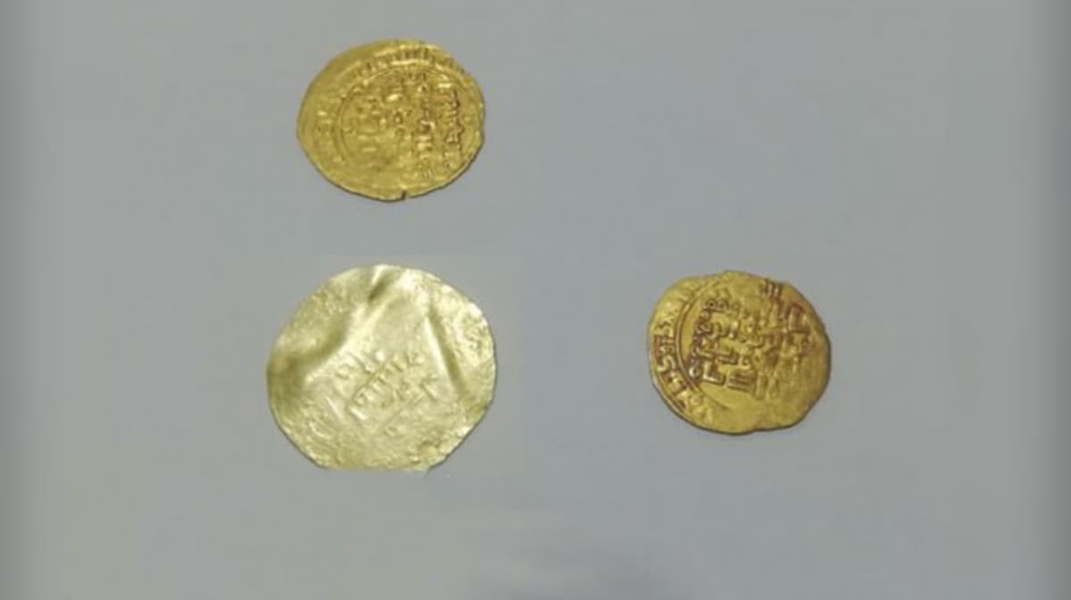 Law enforcement officers detain a man who tried to sell historic coins for $5,000 in Khorezm